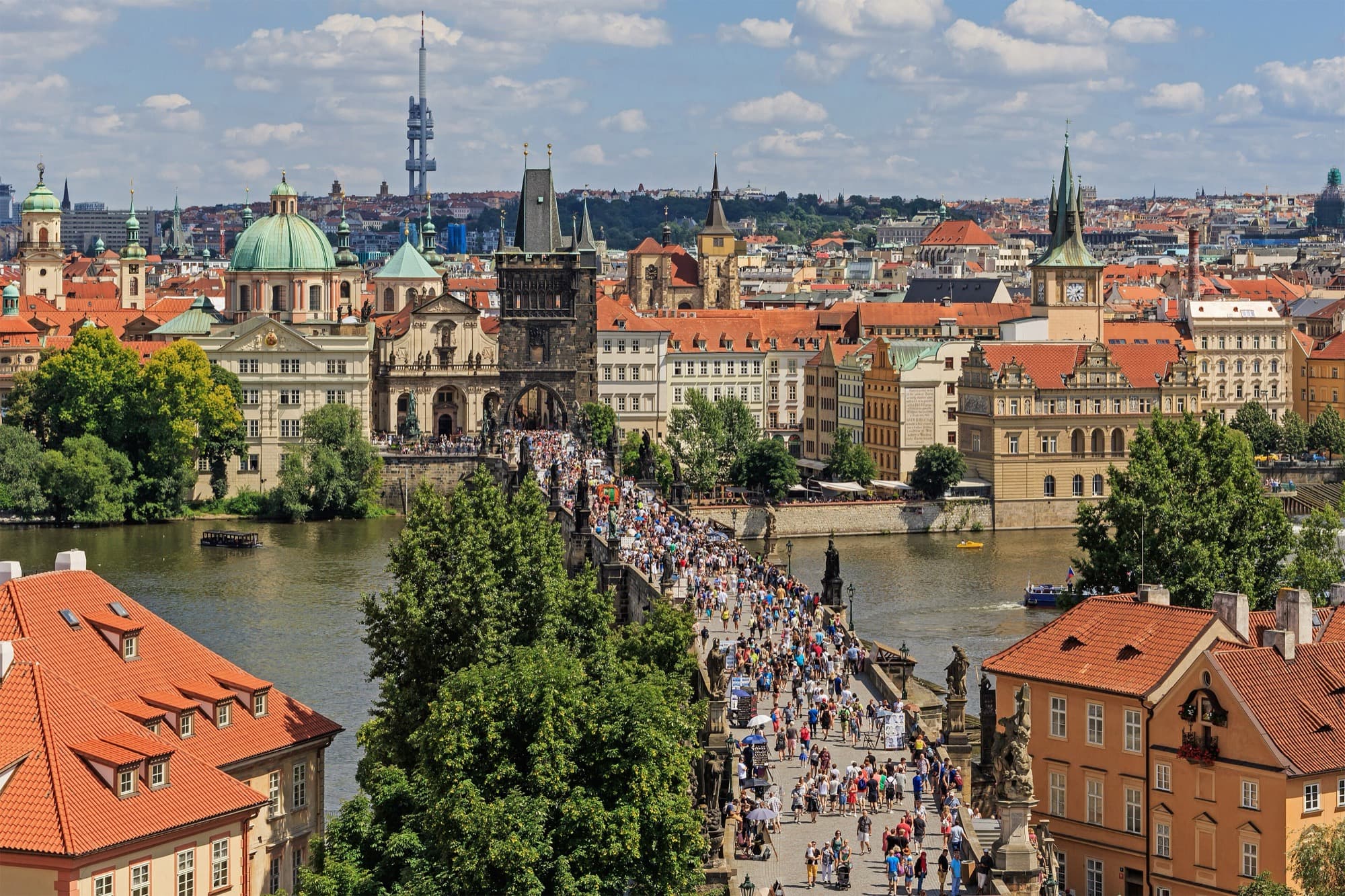 Charles Bridge and Prague Castle in morning mist