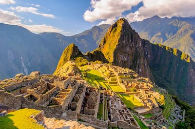 Machu Picchu's terraces emerging from morning cloud