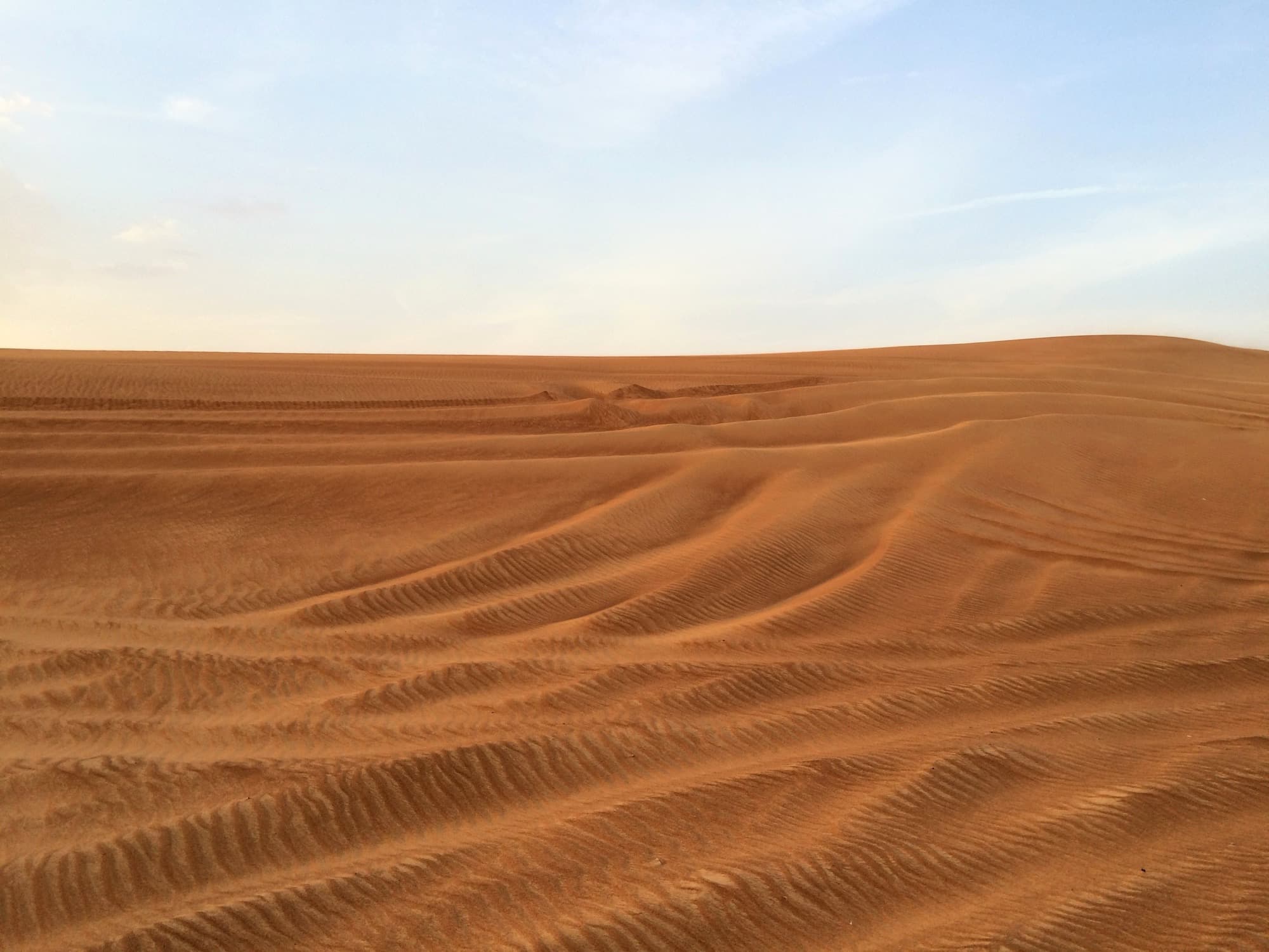 Dune bashing at golden hour in the Lahbab desert