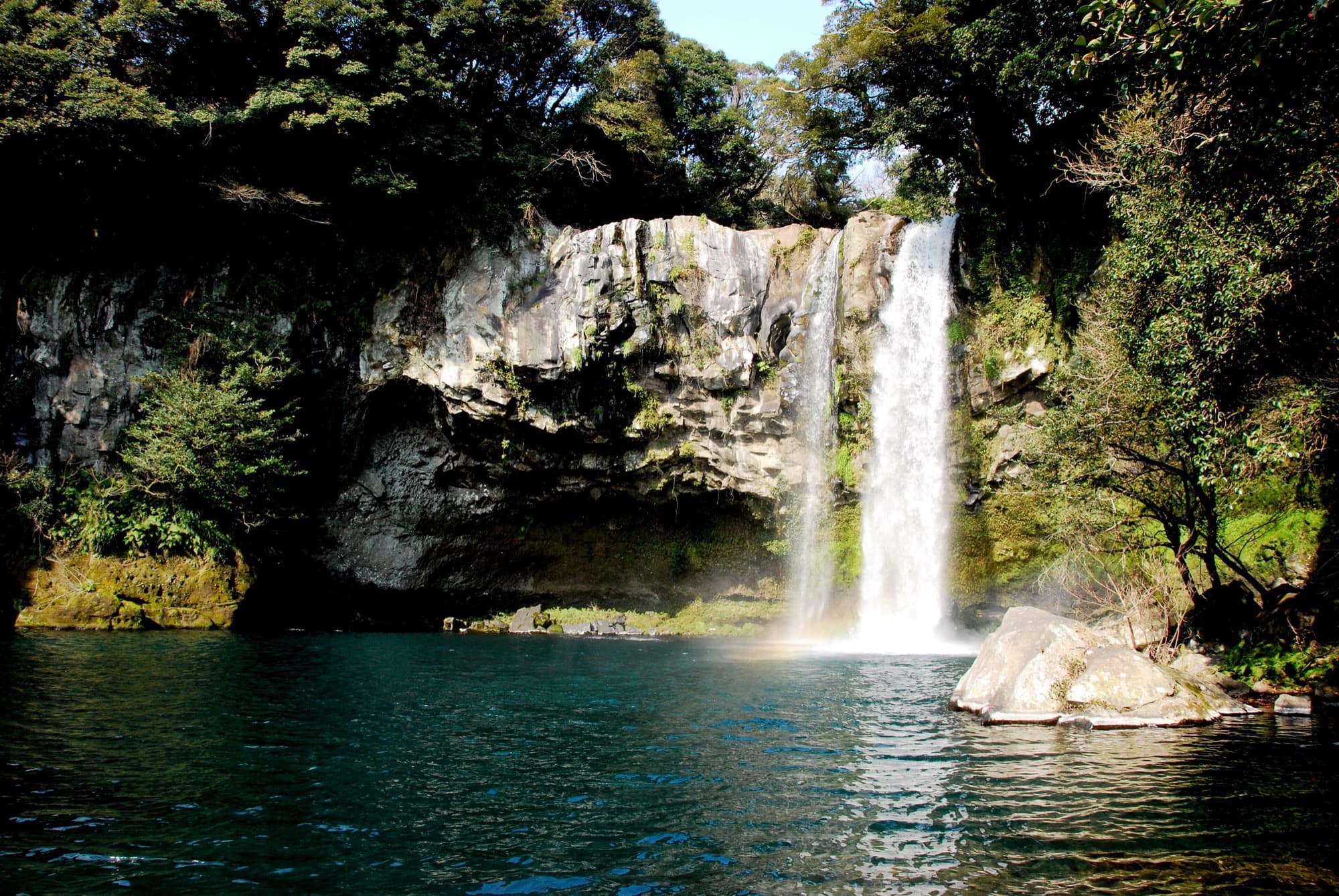 Cheonjiyeon waterfall lit at dusk