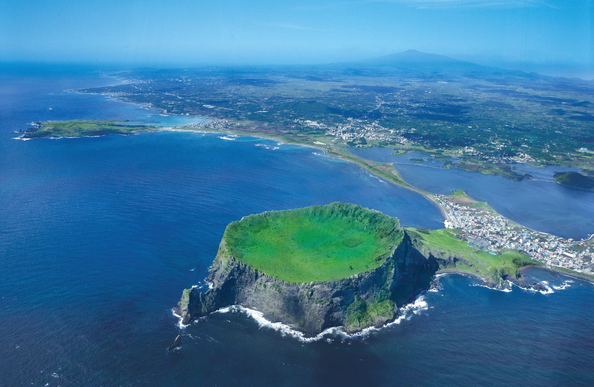 Seongsan Ilchulbong crater rising from the sea